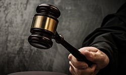 Hand with a gavel about to hit